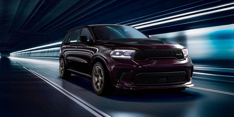 Dark purple Dodge Durango SRT Hellcat driving through a tunnel