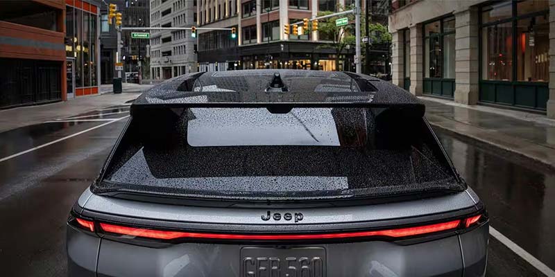 Rear view of a Jeep vehicle with rain on the window